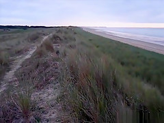 Skinny lady sucking dick and tasting cum by the sea